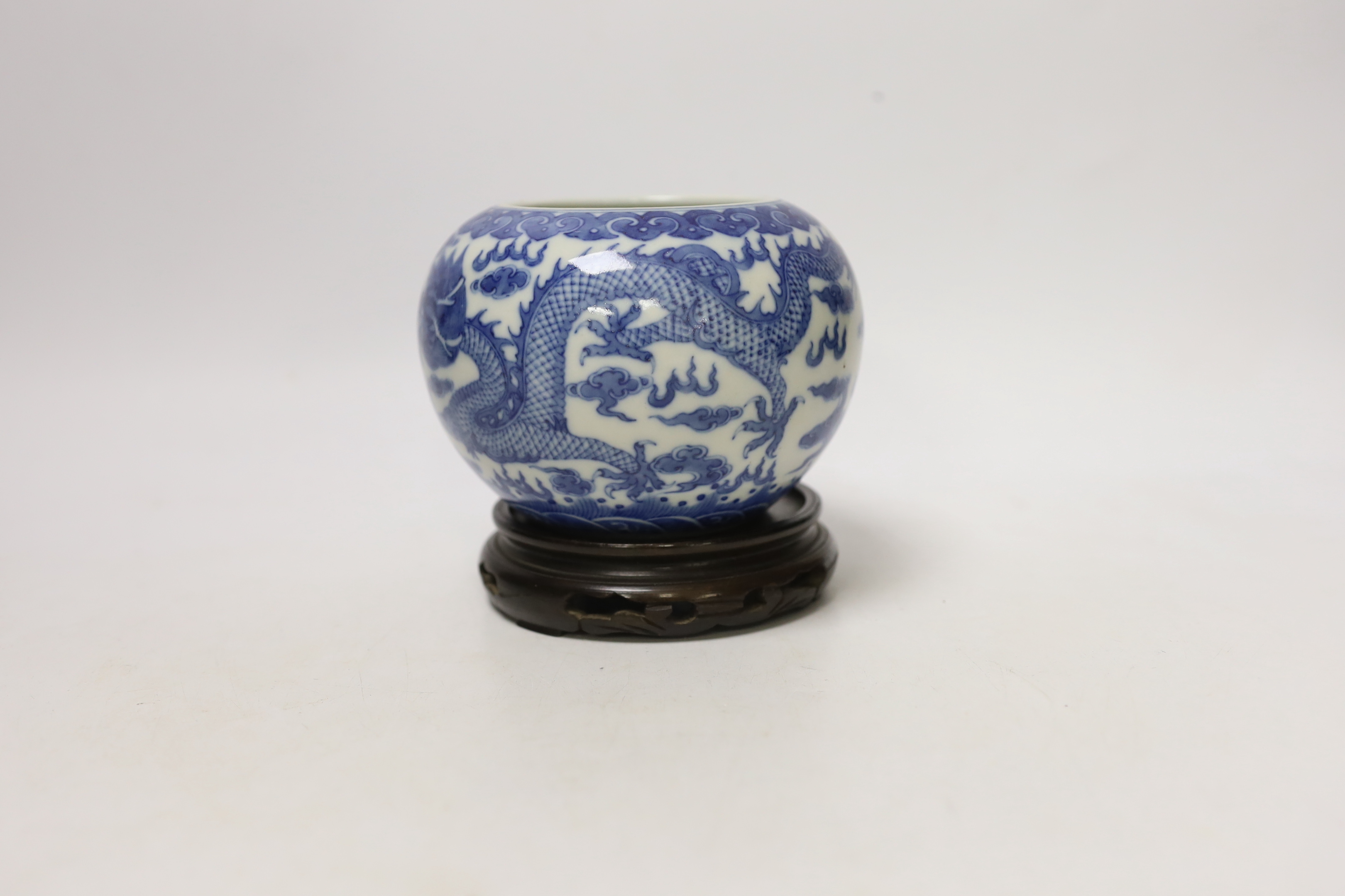 A Chinese blue and white dragon water pot on stand, bowl 12.5cm high including stand